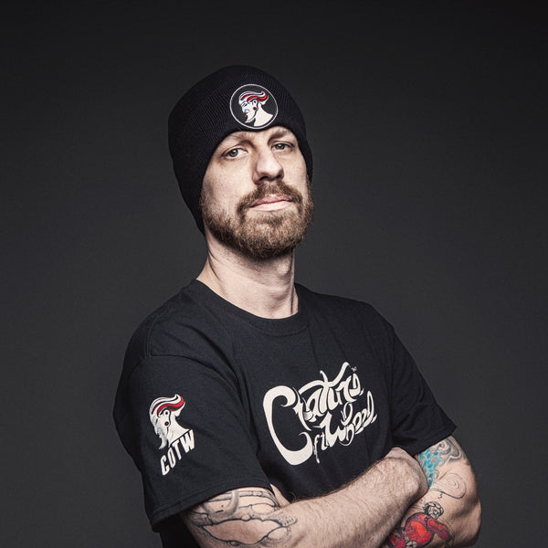 COTW hand lettered t-shirt and beanie on Andrew Hetzel