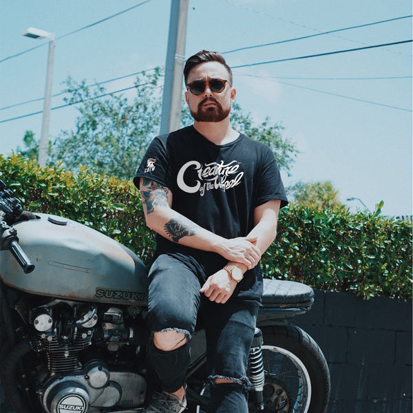 COTW hand lettered shirt design with young male on a motorcycle