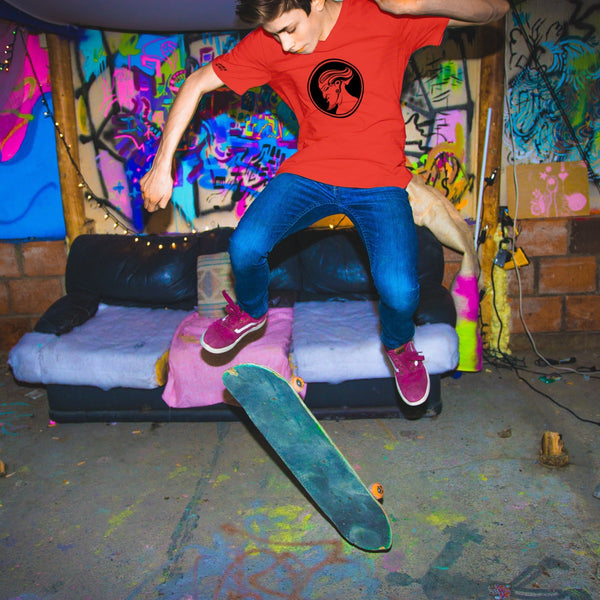 Creature of the Wheel red t-shirt worn by a young male skateboarder